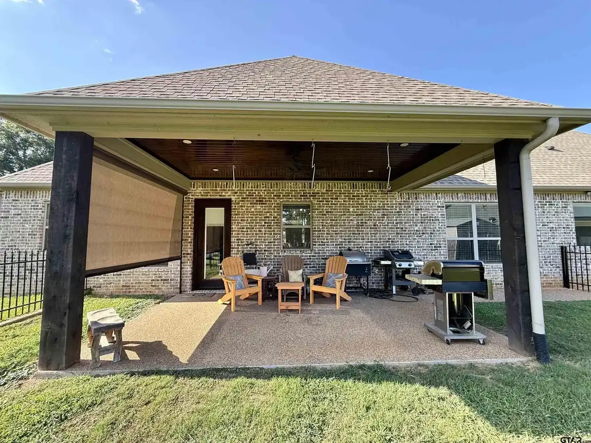 Covered lakefront patio looking out over the yard toward Lake Palestine at 644 An County Road 3009 in Frankston TX