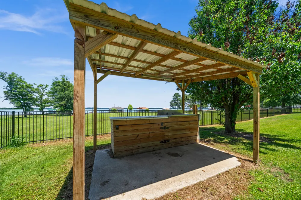 Covered fish cleaning station on Lake Palestine waterfront property at Sunrise Shores Chandler TX for sale